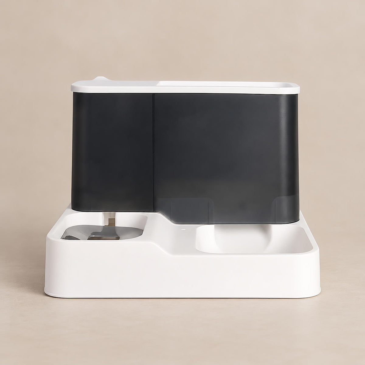 Gravity pet feeder with food hopper and water bottle - studio photograph on a warm neutral backdrop