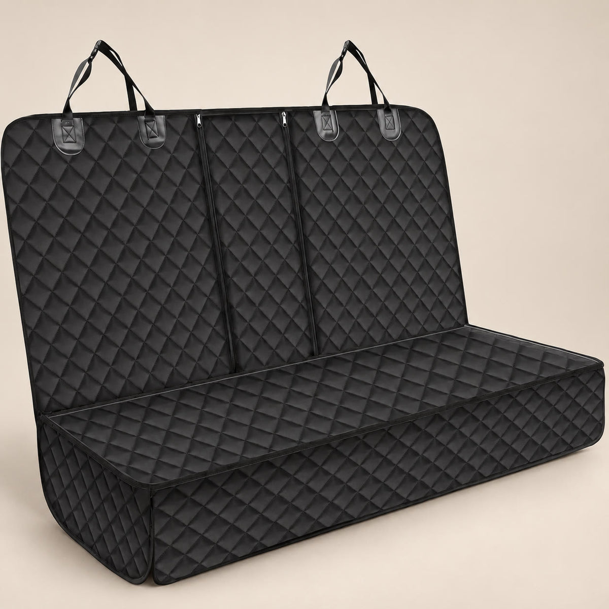 Black quilted car back-seat pet mat with side flaps - studio photograph on a warm neutral backdrop