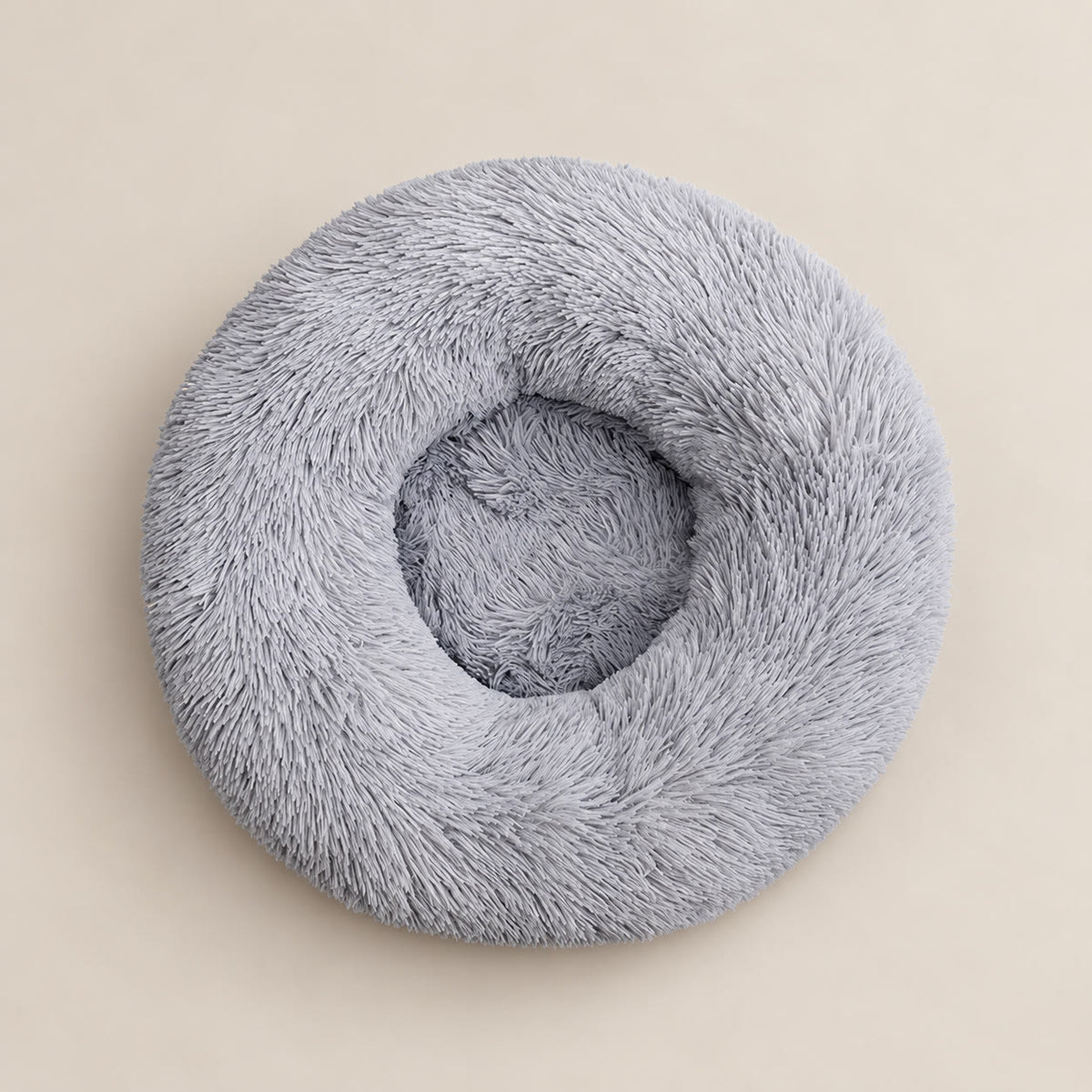 Grey 60 cm round faux-fur pet bed - studio photograph on a warm neutral backdrop
