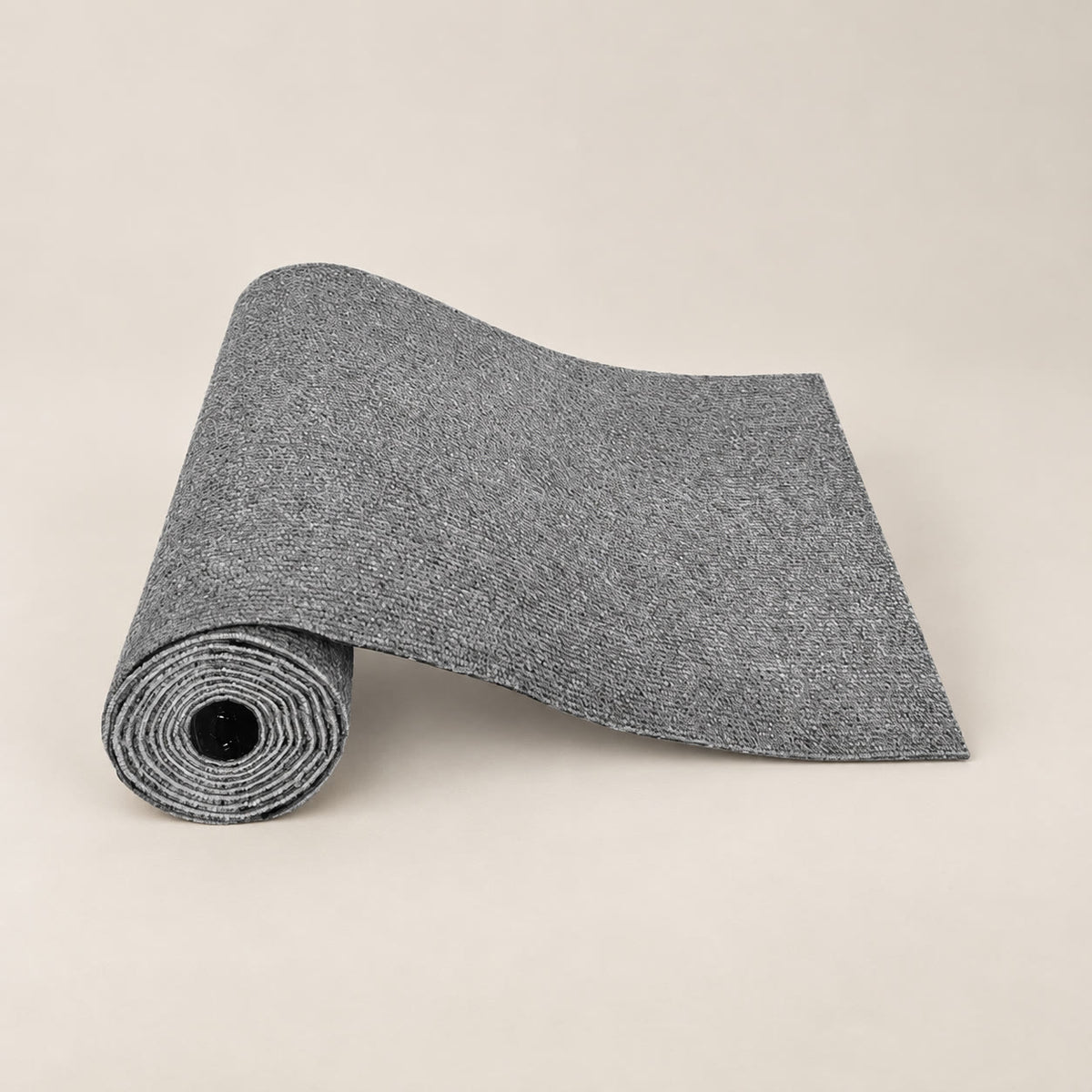 Roll of grey self-adhesive cat scratch mat, 30 x 100 cm - studio photograph on a warm neutral backdrop