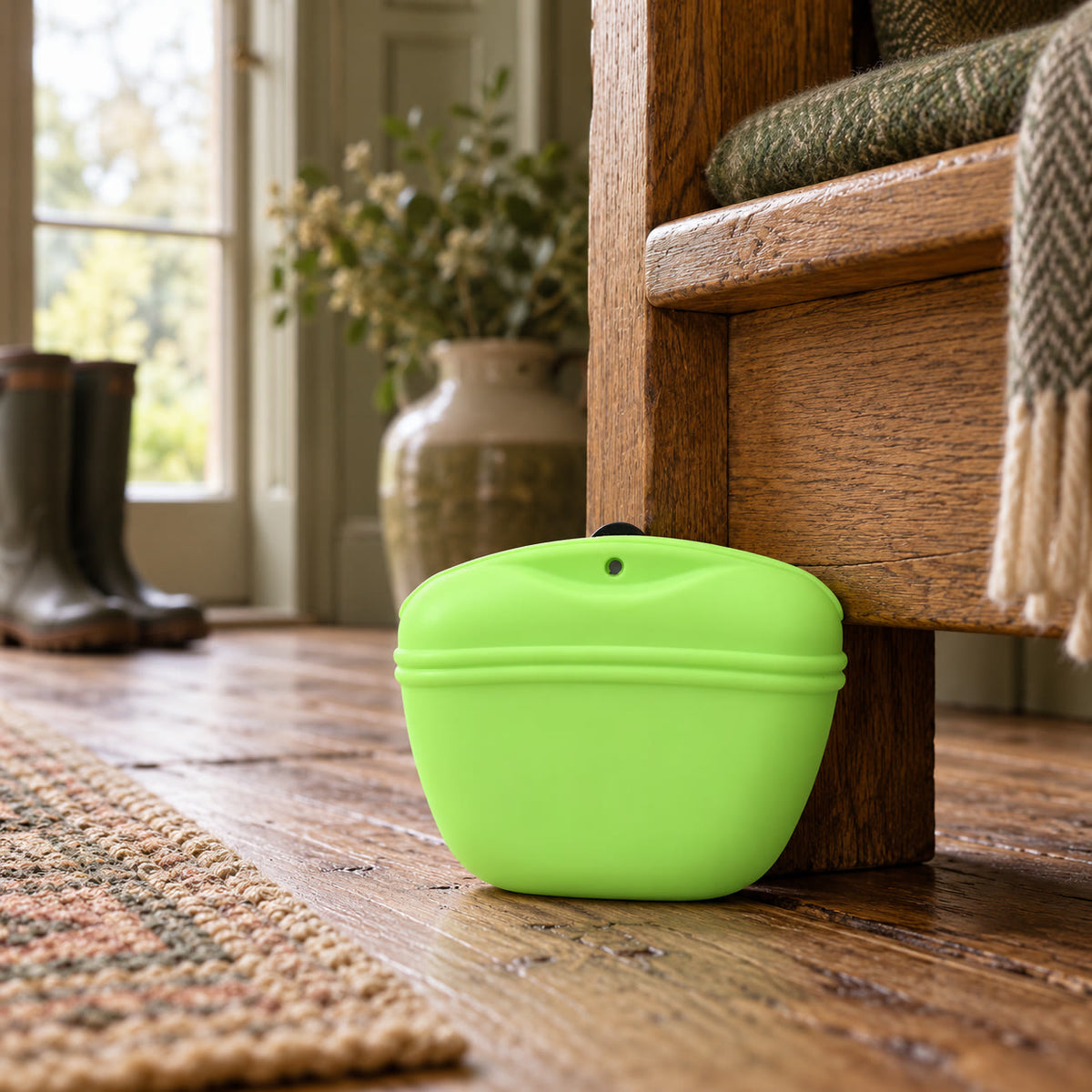 Green silicone dog treat pouch with magnetic opening - styled in a country-house interior
